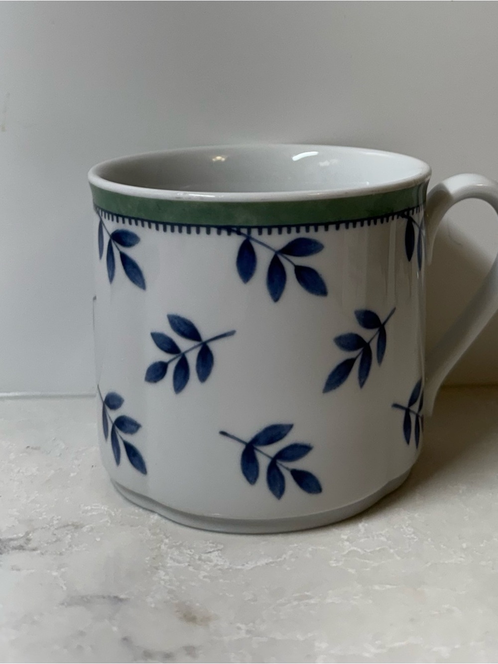 Villeroy & Boch White Porcelain Mug with Blue Leaf Motif and Green Rim